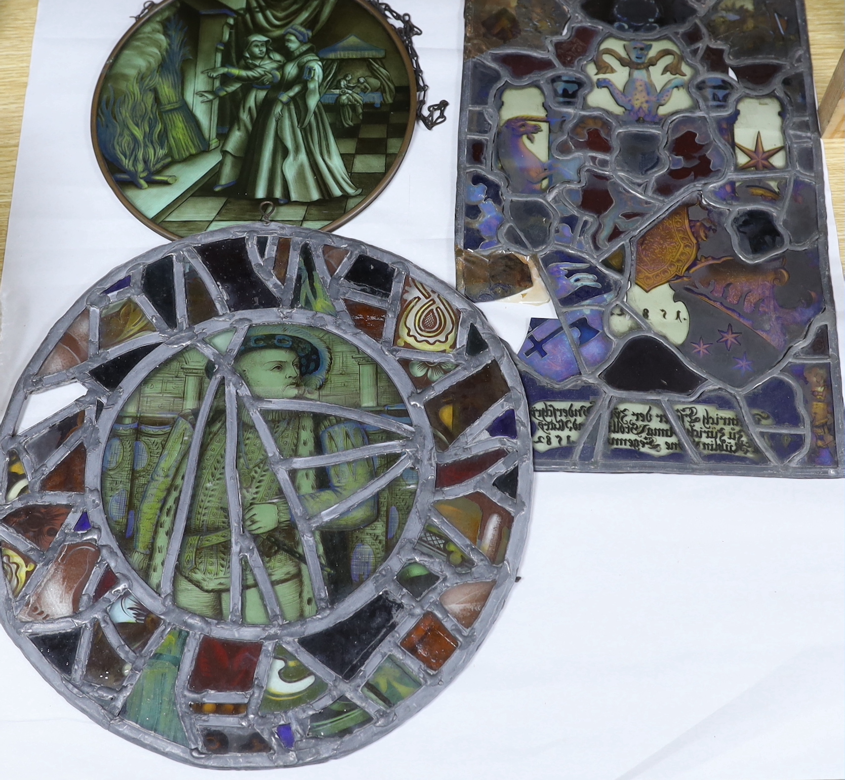 Two panels of early 19th century stained glass, largest 32cm, two tear drop panels, a later panel and a hand blown glass model of a galleon